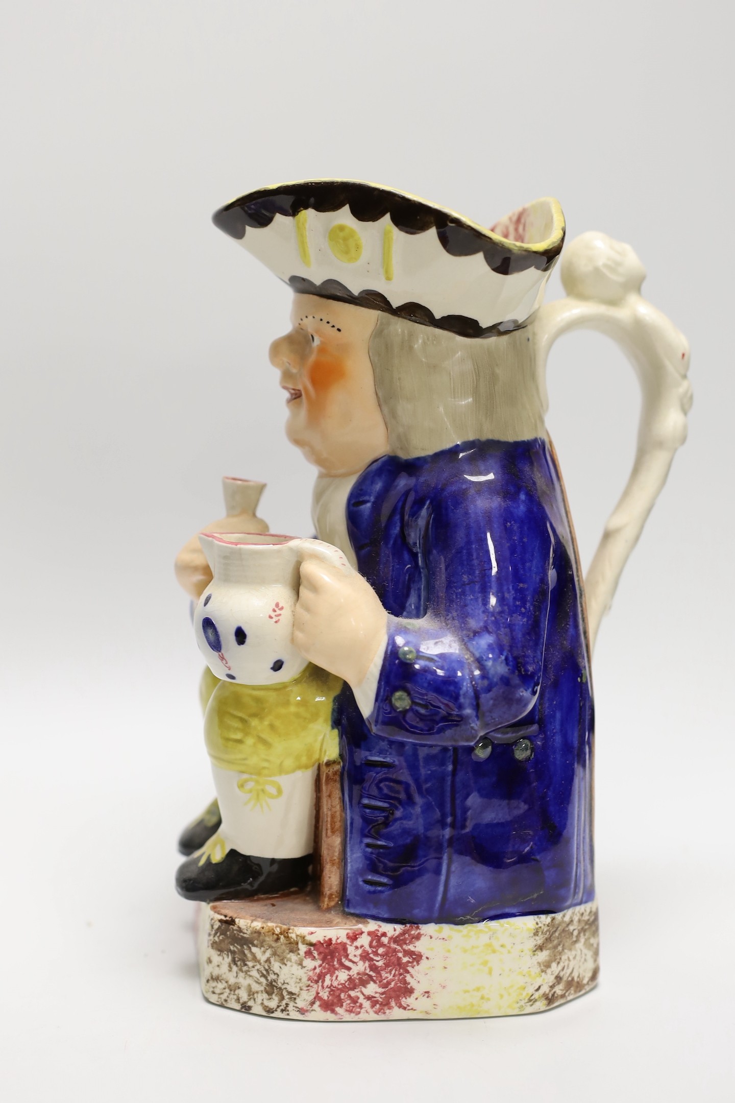 A pair of Derby plates, c.1820, an opaque china jug and a Toby jug. Tallest 24.5cm